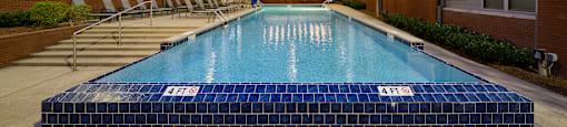 a swimming pool in the middle of an apartment building