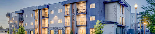 A modern apartment building with the number 2600 on the front.