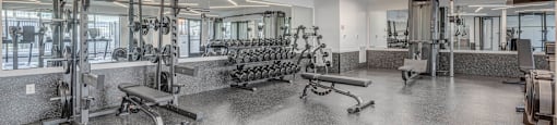 A fitness center with fitness equipment at The Opal apartments in Salt Lake County, Utah.