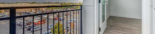 a balcony with a view of a parking lot