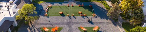 an aerial view of a playground in a neighborhood with trees