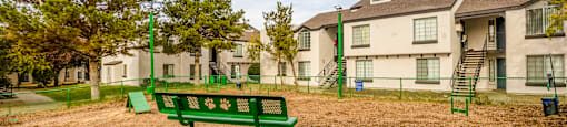 the preserve at ballantyne commons park bench in front of apartment buildings