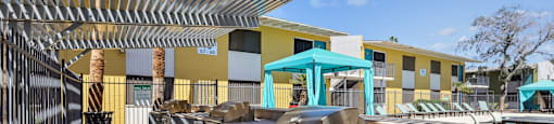 our apartments have a large patio with a grill and a pool
