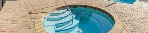 A house with a pool in the backyard. at Cascades at Clear Lake Apartments, Florida