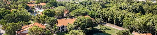 A bird's eye view of a residential area with houses and trees.