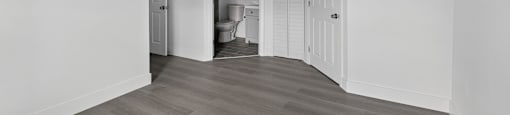 A room with a grey floor and white walls. at Cascades at Clear Lake Apartments, Ft. Myers, FL, 33908