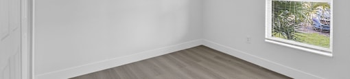A room with a painting on the wall and a white door. at Cascades at Clear Lake Apartments, Ft. Myers, Florida