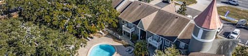 A house with a pool in the backyard. at Foxcroft Apartments, Tampa, 33614