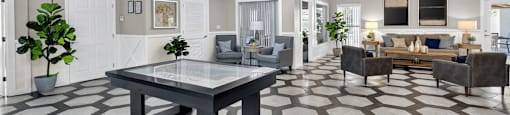 A spacious living room with a large table and chairs. at Cascades at Clear Lake Apartments, Ft. Myers, FL, 33908