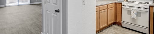 A white door is in a room with a kitchen area.