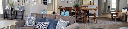 A living room with a grey couch and a coffee table.
