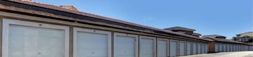 A row of garage doors are closed.