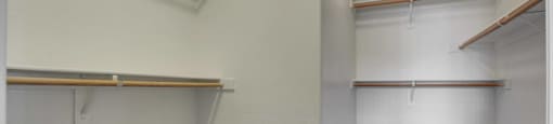 A white wall with a brown carpet and a white ceiling with a light fixture.
