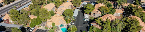 A bird's eye view of a residential area with houses and streets.