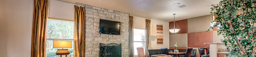 A living room with a fireplace and a couch.