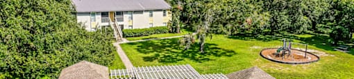 a birds eye view of a house and a playground