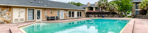 A small pool in front of a building.