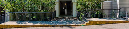 exterior entrance to property surrounded by trees