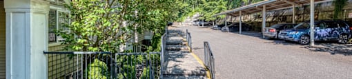entrance to property with parking lot spaces nearby