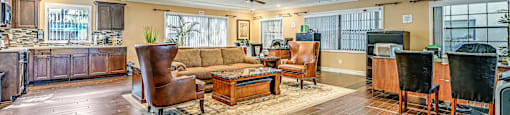 A spacious living room with wooden floors and furniture. at Westminster Chase Apartments, Tampa, 33616