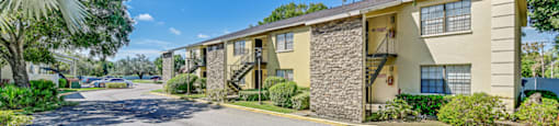 A sunny day at a residential apartment complex with a clear blue sky. at Westminster Chase Apartments, Tampa