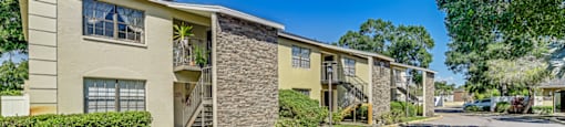 A sunny day at the apartment complex with clear blue skies. at Westminster Chase Apartments, Tampa, Florida