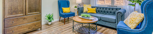 model apartment with vinyl flooring and seating area