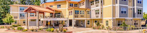 bright sunny entrance to community with trees to the side