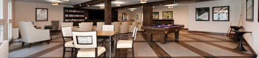 a recreation room with a pool table and chairs at The Crest at Citrus Heights Apartments, Citrus Heights, CA