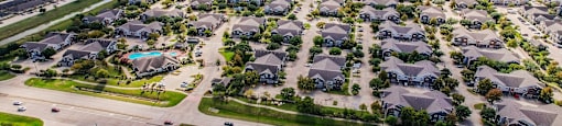 an aerial view of a neighborhood of houses and roads at Sladestone Shadow Creek, Pearland, TX