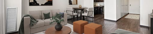 the living room of an apartment with a couch and a table at Presidential Towers, Chicago