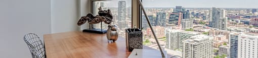 an office desk with a view of the city at Presidential Towers in Chicago, Illinois 60661