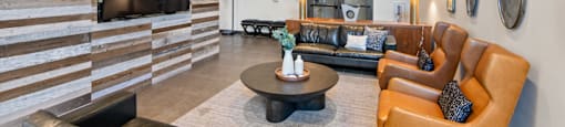 Common Area with Television and Couches at Aventine Apartments in Hercules, CA 94547