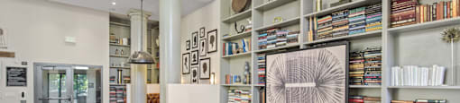 a living room with a bookshelf full of books