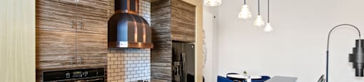 Common Area with Kitchen and Seating at Aventine Apartments in Hercules, CA 94547