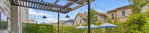 Outdoor Patio with Grill and Seating at Aventine Apartments in Hercules, CA 94547