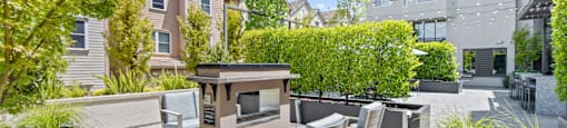 Outdoor Patio with Fire Pit and Seating at Aventine Apartments in Hercules, CA 94547