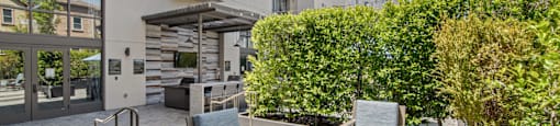 Outdoor Patio with Fire Pit and Seating at Aventine Apartments in Hercules, CA 94547