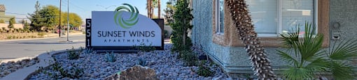 the sign outside of sunset winds guest house at Sunset Winds Apartments in Henderson, Nevada 89014
