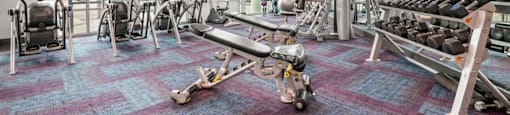 a gym with weights and cardio equipment  at South Side Flats, Dallas, 75215