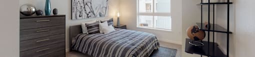 a bedroom with a bed and a dresser and a window at OLiVE DTLA in Los Angeles, California 90015