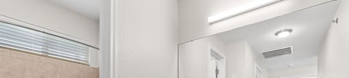 bathroom with sink and mirror at Switchback on Platte Apartments, Colorado, 80120