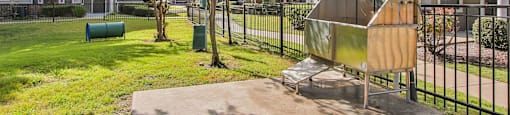 our apartments have a spacious yard with a grill and trees at Sladestone Shadow Creek, Texas, 77584