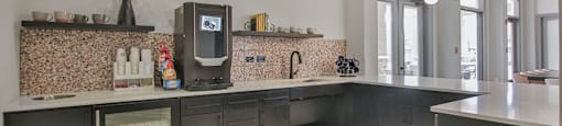 a kitchen with a large counter top and a sink at Sladestone Shadow Creek, Pearland