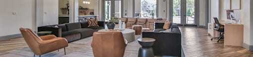 a large lobby with couches and chairs and a large chandelier at Sladestone Shadow Creek, Pearland, TX, 77584