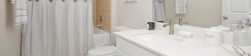 a bathroom with a shower and a toilet and a sink at Sladestone Shadow Creek, Pearland, TX, 77584