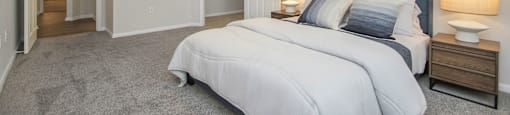 a bedroom with a large bed and a ceiling fan at Sladestone Shadow Creek, Pearland, TX