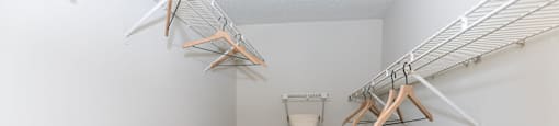 our spacious walk in closets are equipped with shelves and baskets for storage of laundry at Briarcliff Apartments, Georgia