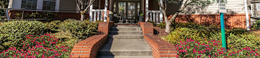 the front of a house with stairs and a sidewalk at Briarcliff Apartments, Atlanta, 30329