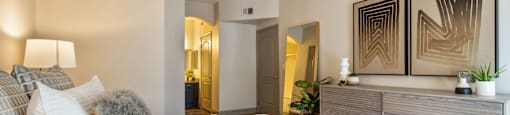 a bedroom with a large bed and a dresser at Mirasol Apartments, Las Vegas, Nevada